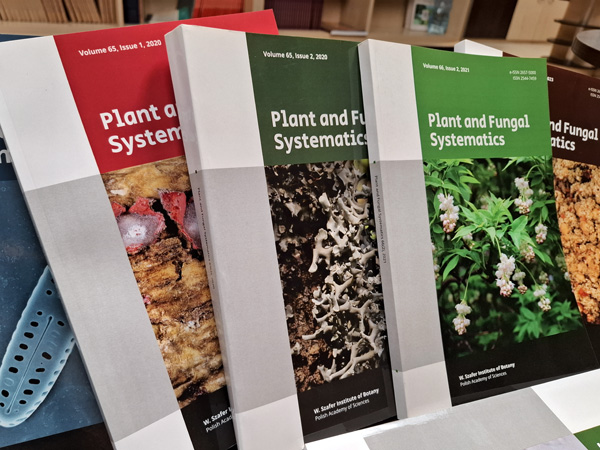 Several issues of the journal Plant and Fungal Systematics arranged side by side, with colorful covers